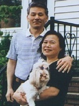 Chang Ho Yi and Hye Chong Yi with their dog